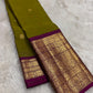 Handwoven Kanjeevaram saree featuring betel leaf green body with heritage Yazhi butta weaving