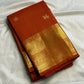 Earthy burnt-orange handwoven Pure Silk Kanjivaram Butta saree with gold zari buttas