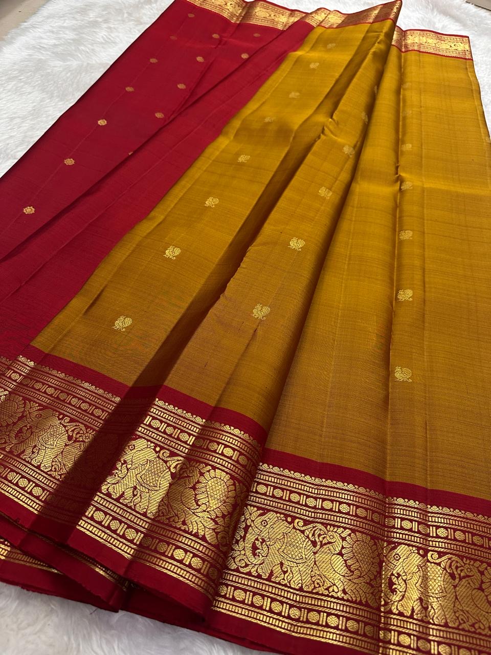 Kanchipattu silk saree in korvai with earthy mustard yellow border weave traditional zari detail