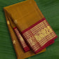 Kanchipuram silk saree in korvai with earthy mustard yellow border weave folded view
