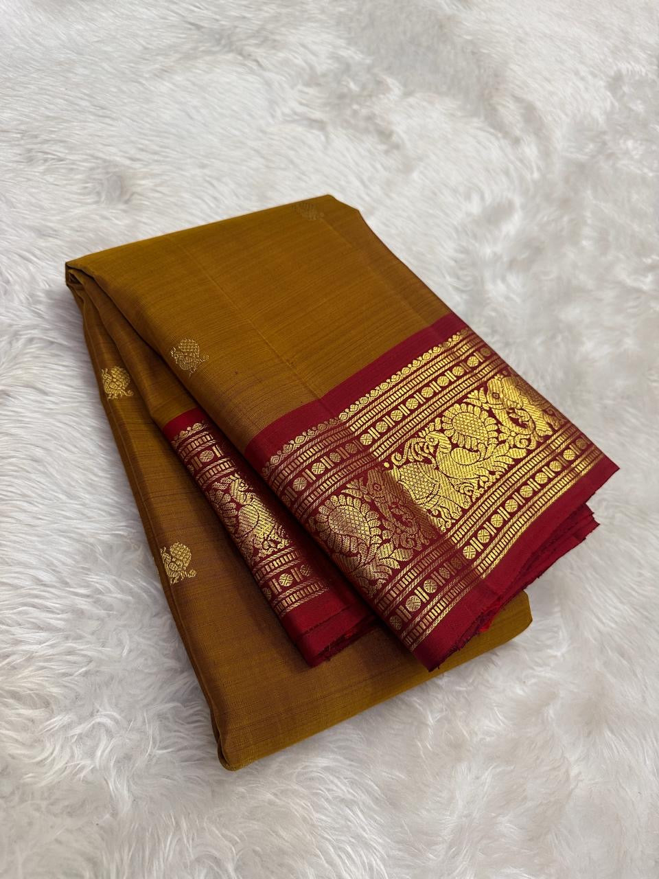 Kanchipattu silk saree in korvai with earthy mustard yellow border weave traditional zari detail