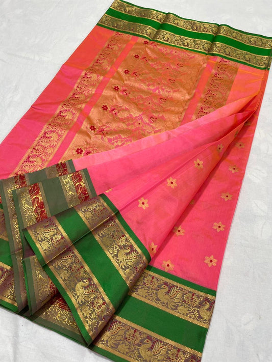 Close view of Coral Pink handloom Chanderi saree with small gold buttas and ornamental woven border