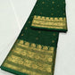 Emerald Green Chanderi Katan Silk saree folded to show the silk's luminous surface