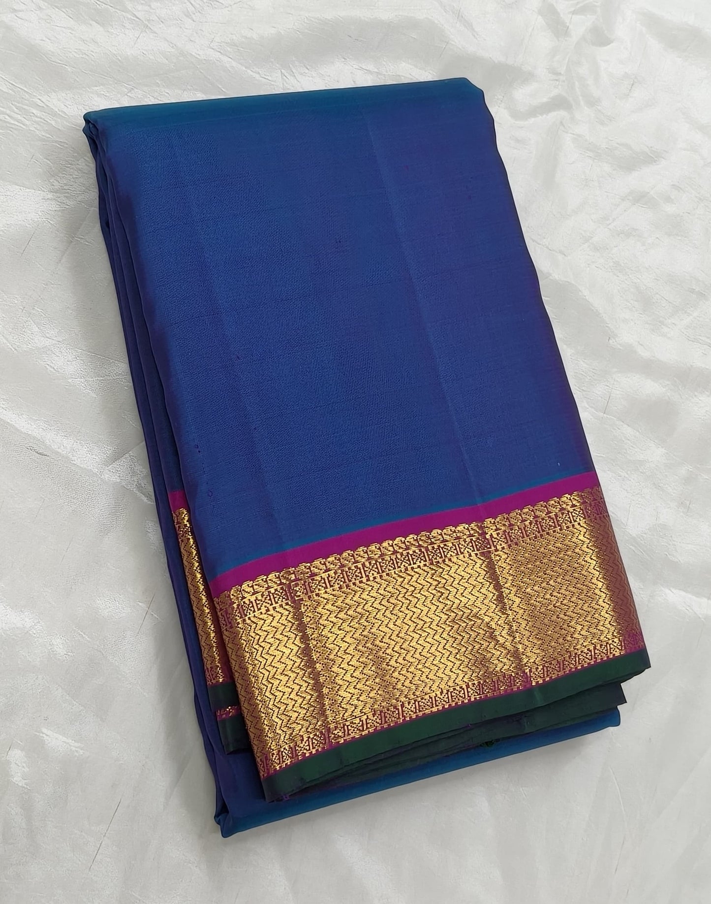 Pure silk Kanjivaram saree in royal ink blue with magenta zari korvai border – close up