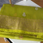 Lustrous zari pallu of chartreuse Ektara Kora Banarasi saree with intricate woven detailing

