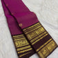 Deep brown pallu with closely packed gold diamond checks and floral zari work on a Vadamalli pink Kanjipuram saree