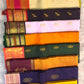 Elam pachai Kanchipuram silk saree with korvai orange border and purple selvedge.
