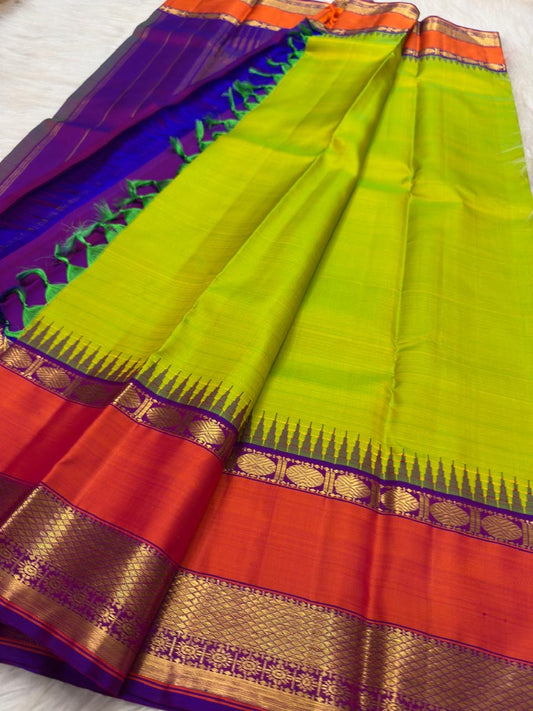 Elam pachai Pure Silk Kanchipuram saree with korvai orange border and purple-magenta selvedge.