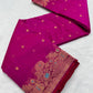 Folded purplish pink Katan silk Chanderi saree showing the gold-toned buttas and ornate floral border