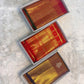 Vermilion Red Gold Checks pure silk Kanchipuram saree, border zari, showing brilliant kumkum red, warm vermilion orange highlights and glowing yellow-gold zari