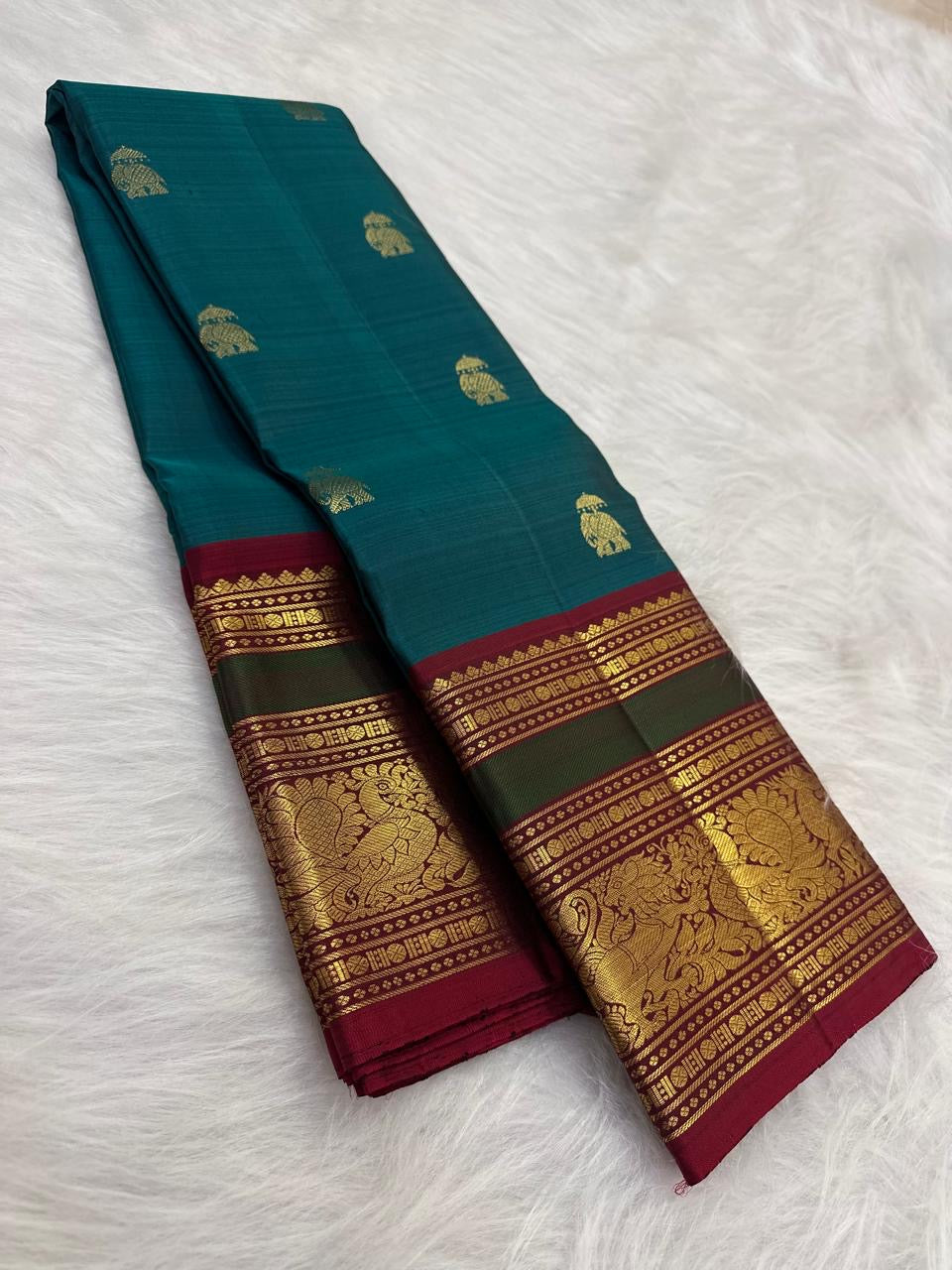Peacock teal Elephant Ambari Butta Kanjivaram saree with Arakku and green zari border