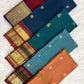 Close view of stylised birds and floral scrolls inside the broad gold paisley border