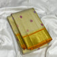 Elephant procession pallu on a Warm Ivory Kanjipuram silk saree - Idam Living