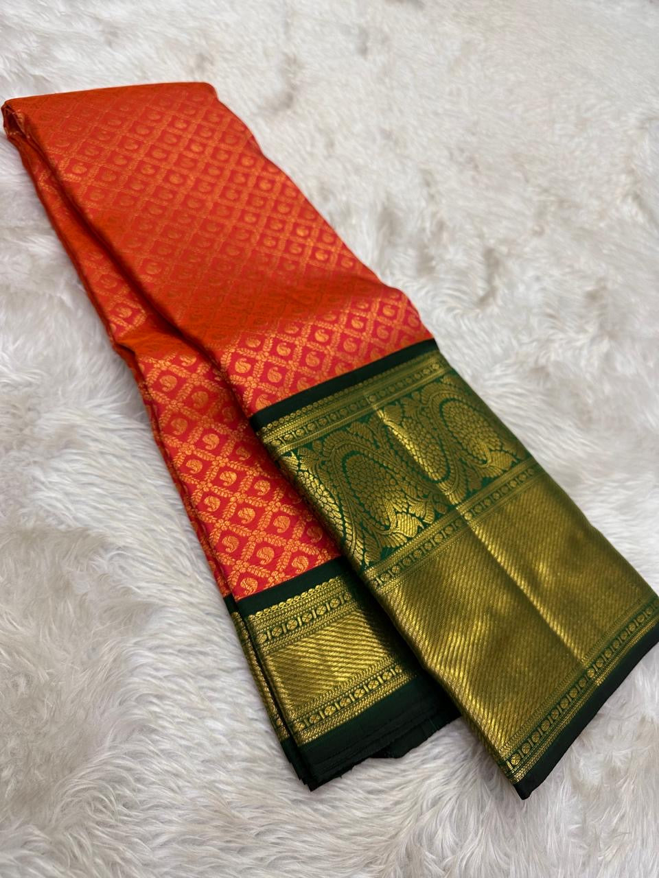 Ember Orange Pure Silk Kanchipuram Zari Kattam saree.