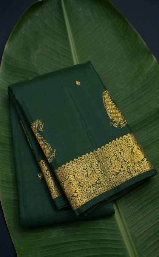 Kanchipuram silk saree in emerald green with antique gold border Maanga Butta weave folded view