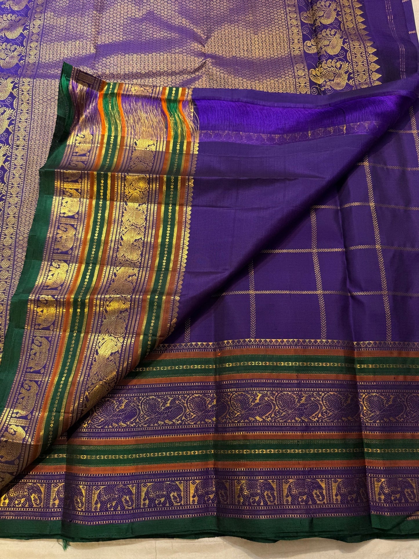 Royal Purple pure silk Kanchipuram saree — emerald green border