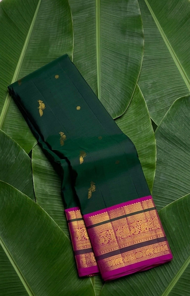 Emerald green and magenta butta Kanjeevaram silk saree with mayil butta and vanasringaram pallu — Idam Living