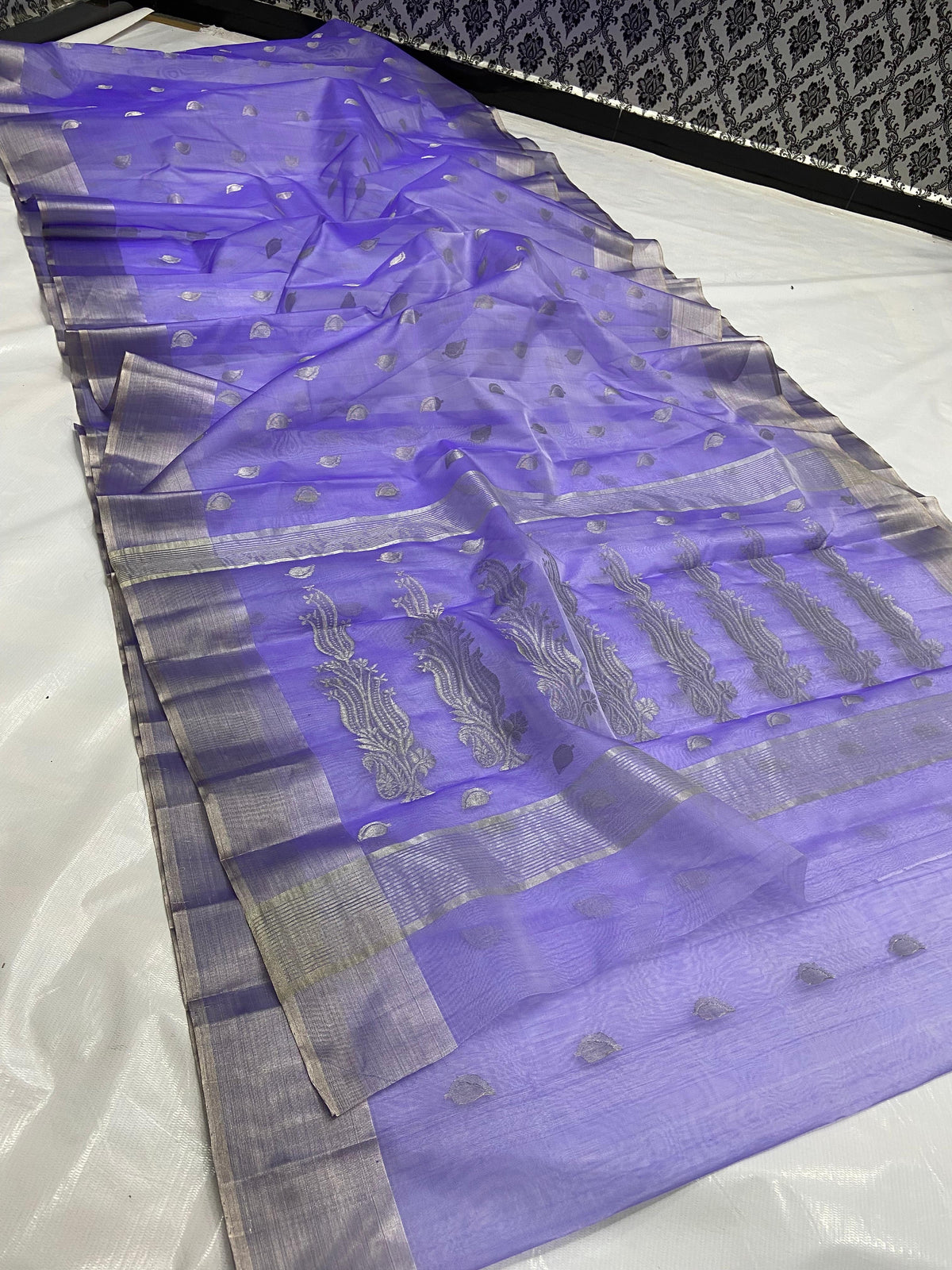 Amethyst lavender Chanderi silk saree showing silver-grey borders and the decorative paisley-vine pallu