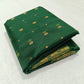Emerald Green Chanderi Katan Silk saree displayed to show the jewel-toned green silk body and gold zari border