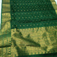 Close-up of Emerald Green Chanderi Katan Silk saree body showing small spaced gold-toned woven accents