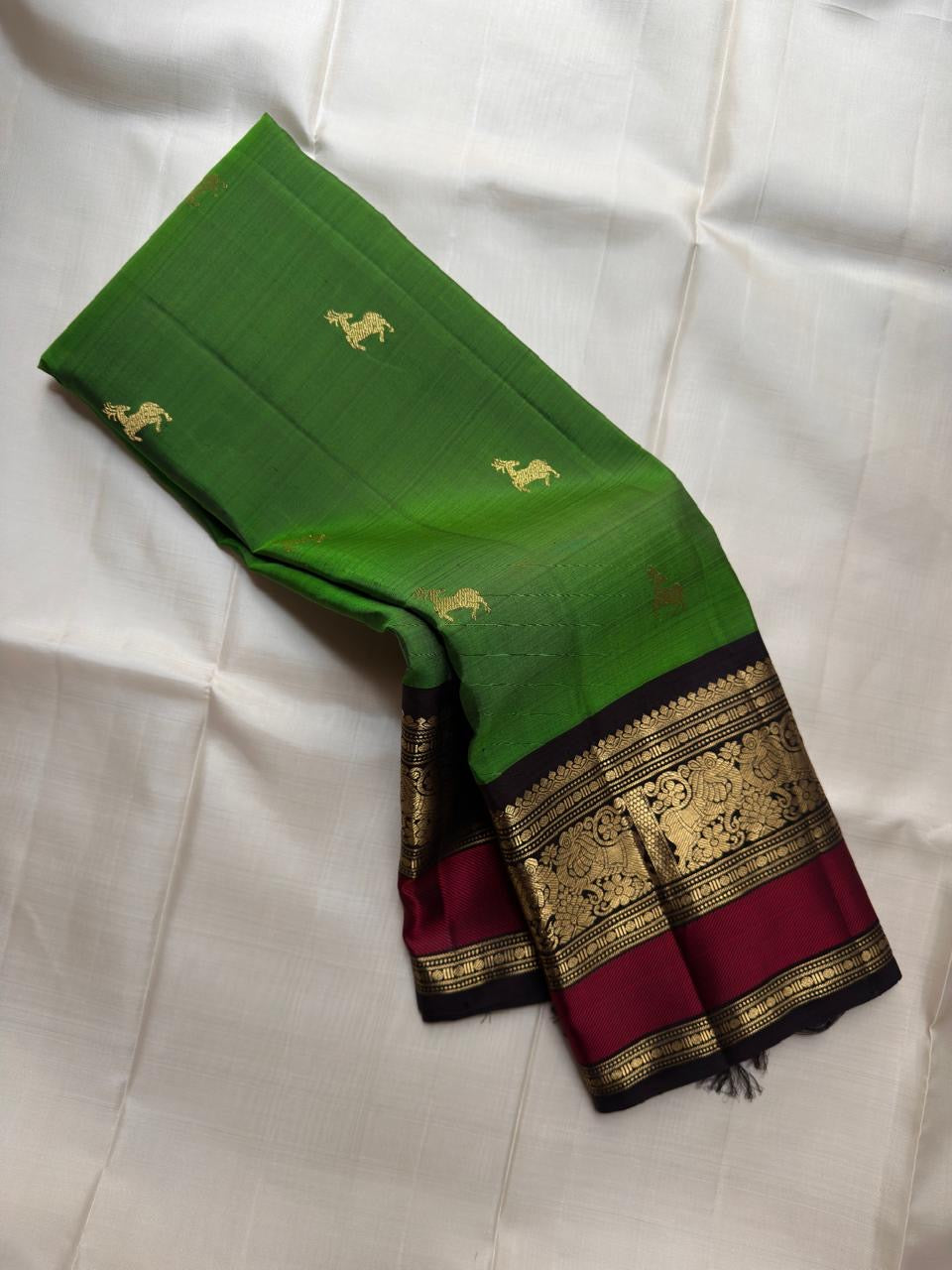 Emerald Green pure silk Kancheepuram saree, Butta weave with Deep Aubergine border — full drape view