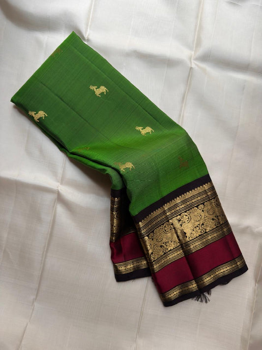 Emerald Green pure silk Kancheepuram saree, Butta weave with Deep Aubergine border — full drape view