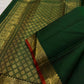 Traditional elephant motif border in antique gold on Deep Emerald Green Kanjivaram saree.