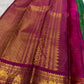 Gold zari lines catching light on emerald-green KanchiPattu saree