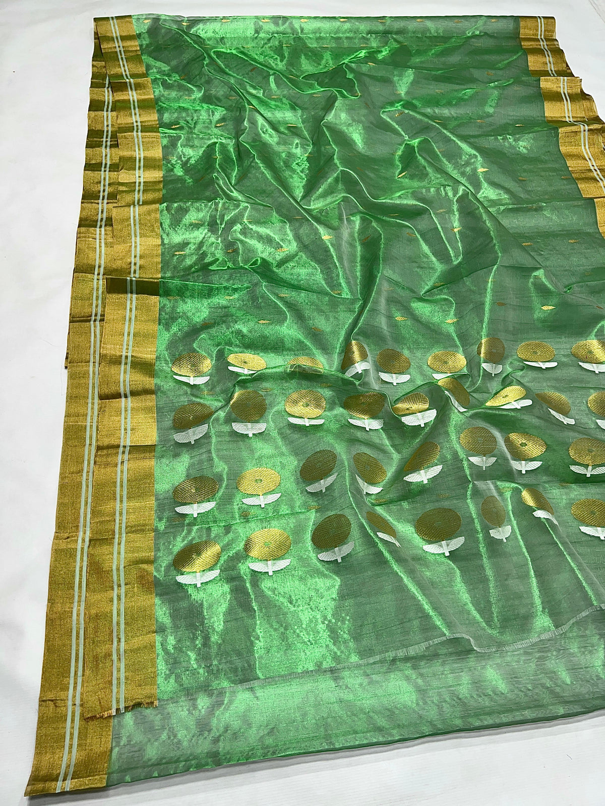 Handwoven jade green tissue silk saree with metallic sheen