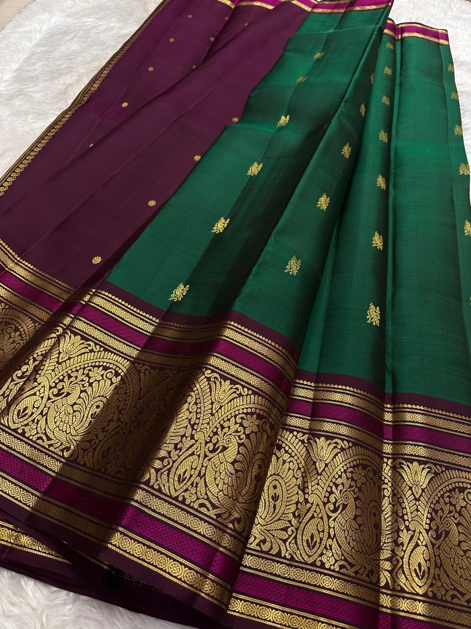 Emerald green Kanchipattu saree with ornate sorgavaasal mayil peacock border – Idam Living