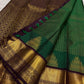 Emerald green Kanchipuram silk saree with Zari Kattam weave and purple Thazhampoo Reku border — Idam Living