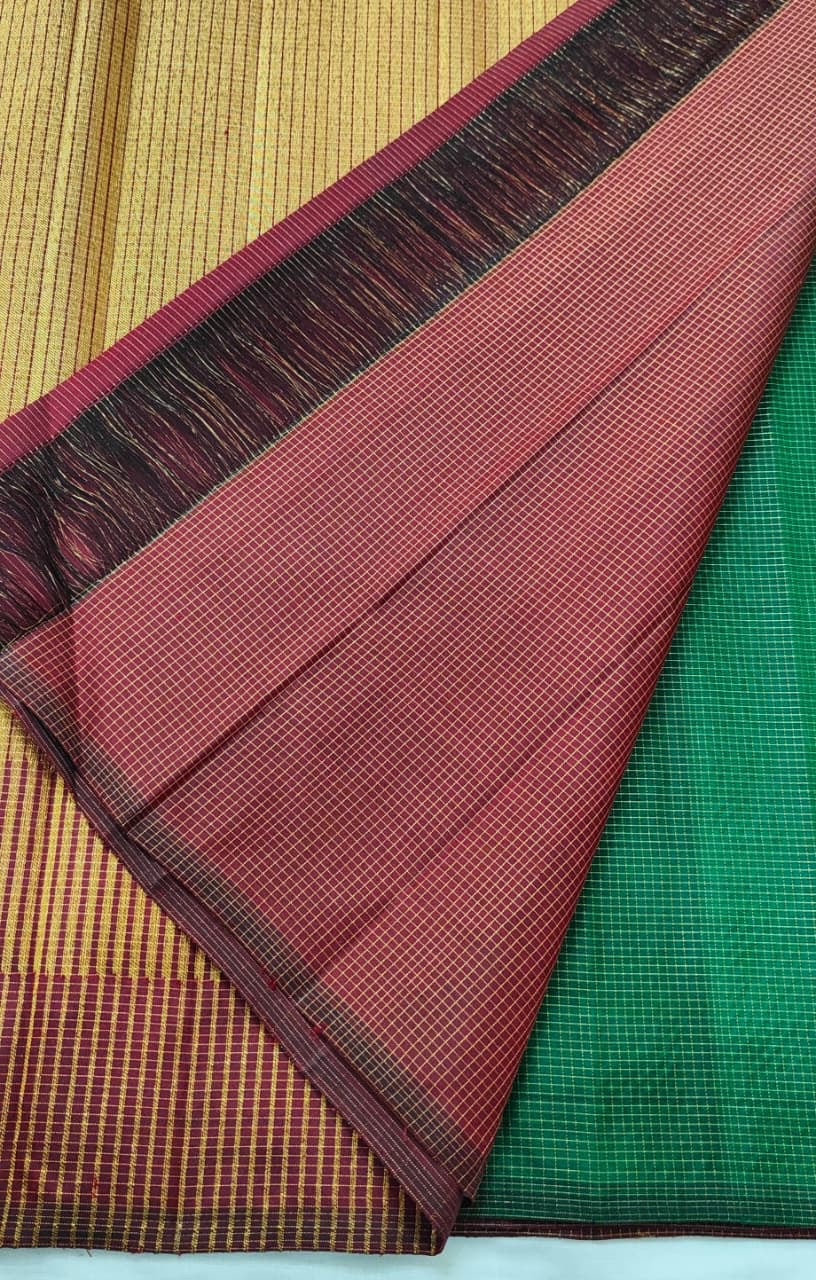 Emerald green Kanjivaram saree with delicate Oosi Kattam zari