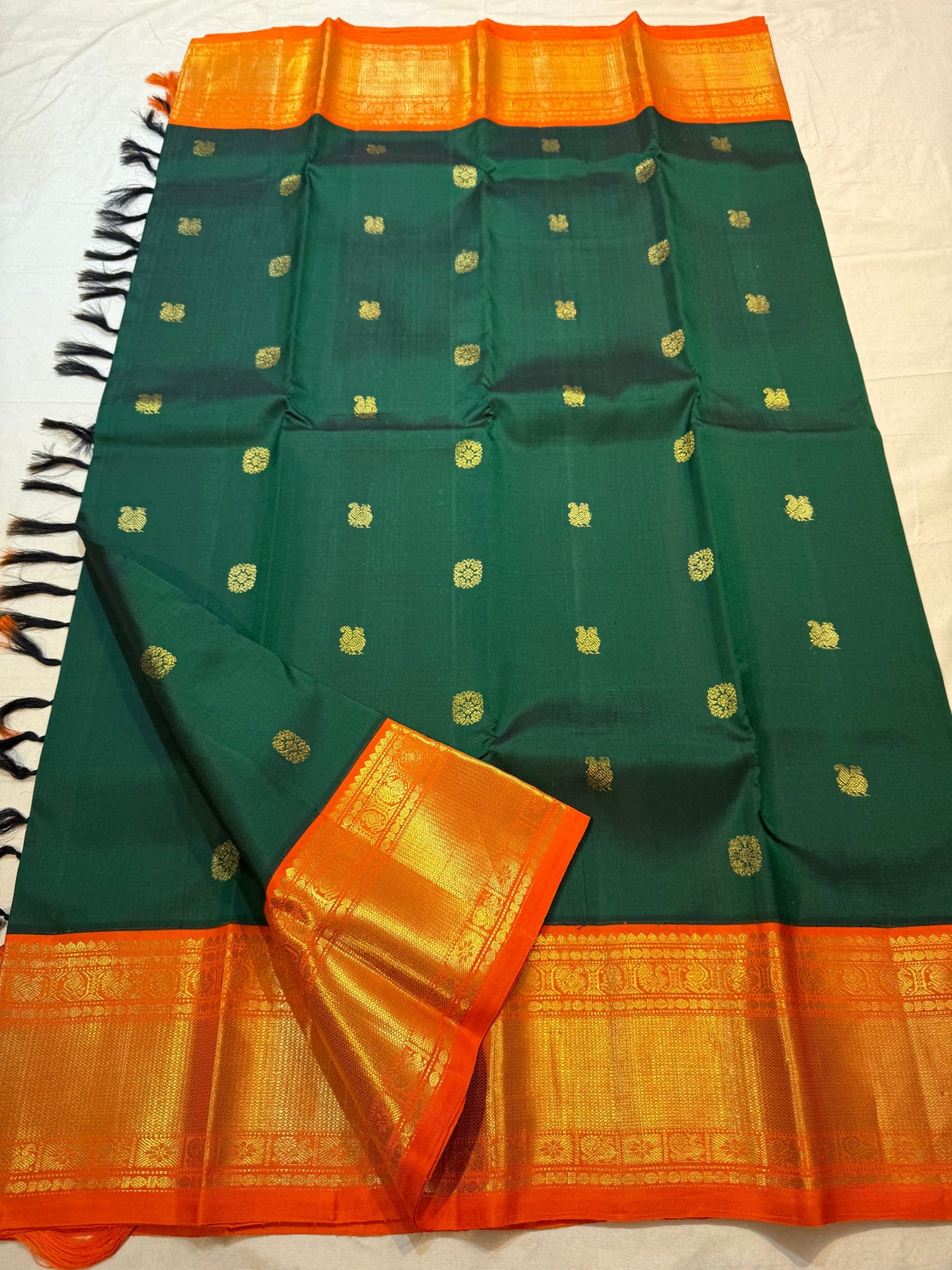 Handwoven Emerald Green Kanjivaram saree with Radiant Orange contrast