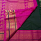 Folded view of emerald green and magenta butta Kanjeevaram silk saree with vanasringaram pallu — Idam Living