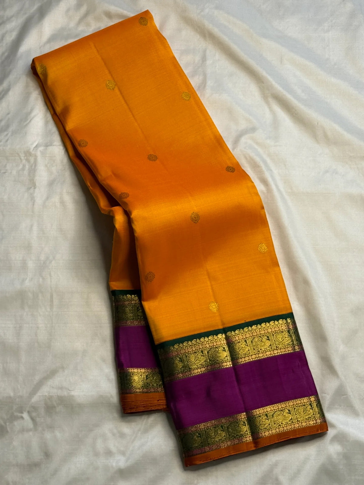 Handwoven Turmeric Yellow Kanjivaram saree with Emerald Green pallu