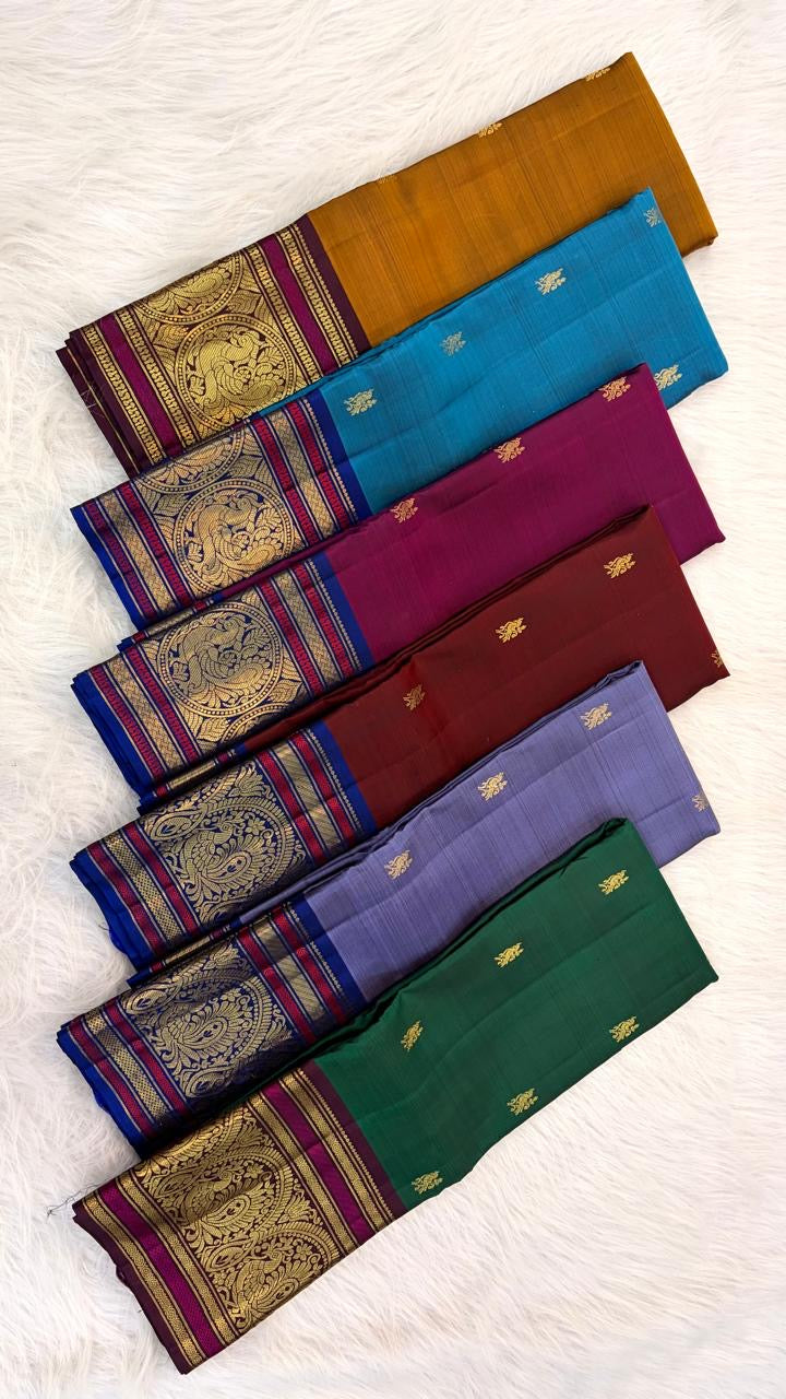 Emerald Green and Magenta Handwoven Pure Silk Kanchipuram Saree with Sorgavaasal Mayil Border
