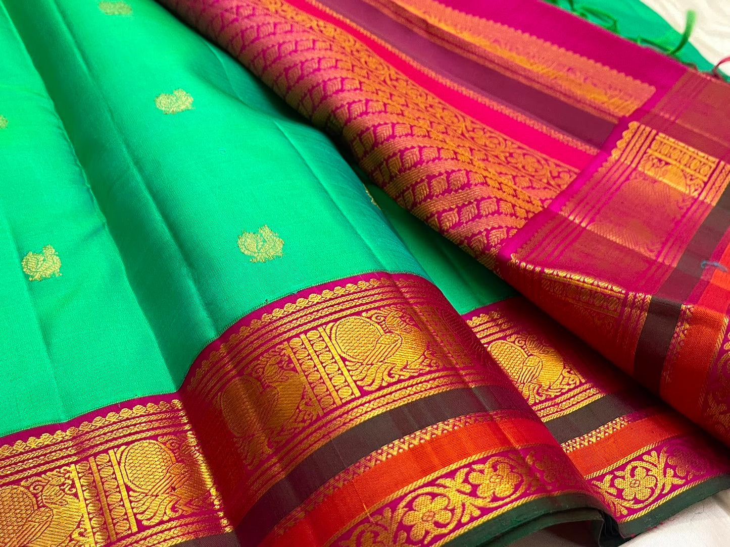 Emerald Aqua Green Shot-Colour Handwoven Pure Silk Kanchi Pattu Korvai Saree with Gold Zari Buttas and Raspberry Pink Pallu