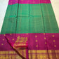 Close view of elephant and circular Chakram zari buttas across Emerald Pachai Green silk.