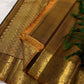 Emerald green Kanjeevaram silk saree with traditional gold zari close-up