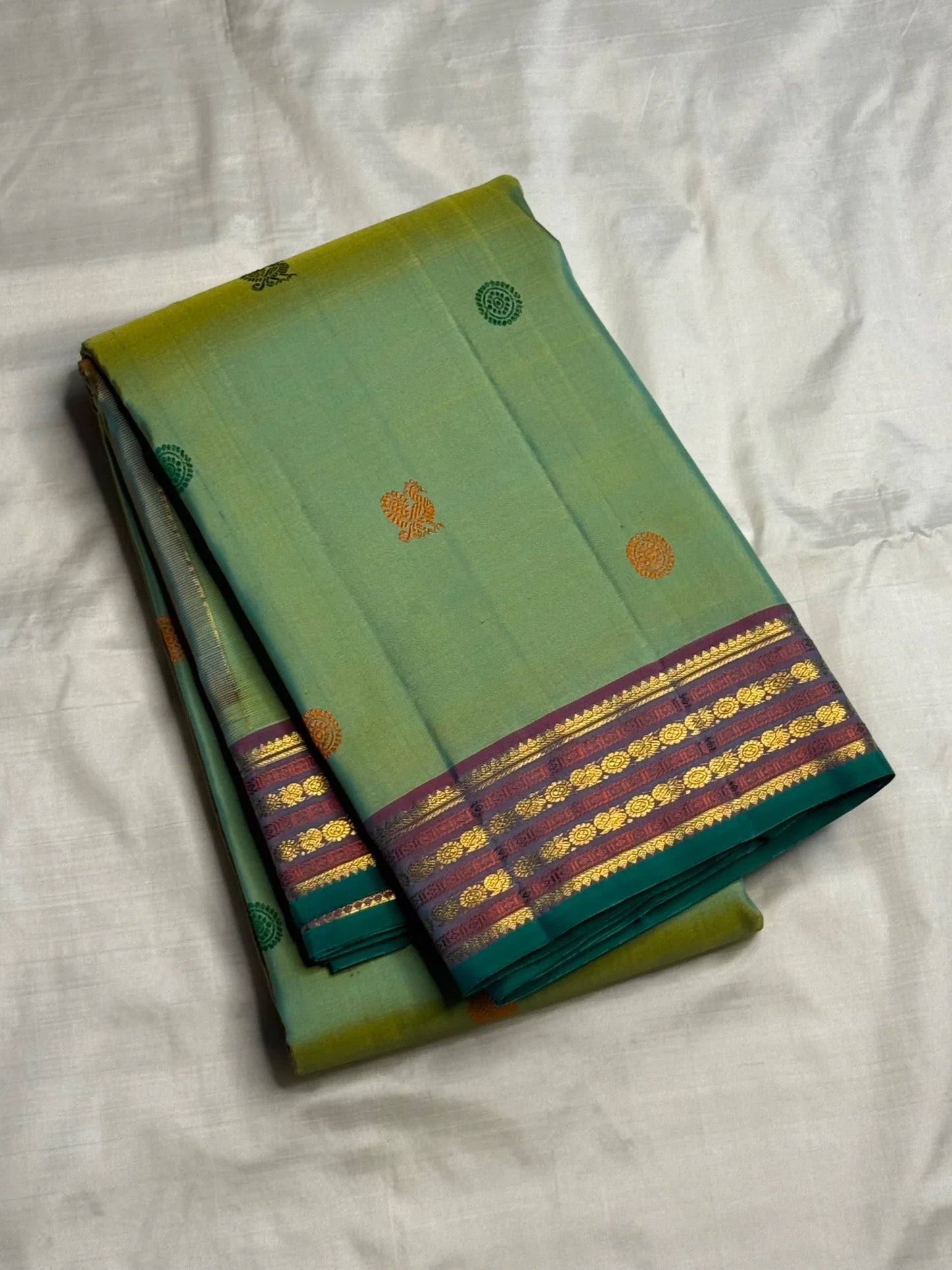 Emerald and Parrot Green Shot Colour Handwoven Pure Silk Kanchi Pattu Saree with Mayil Chakram Butta and Korvai Border