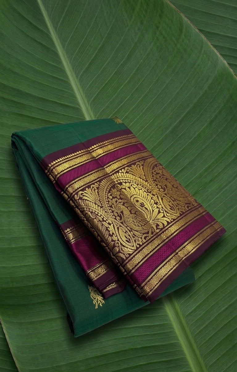 Emerald teal green Kanjivaram silk saree with magenta violet border – front view