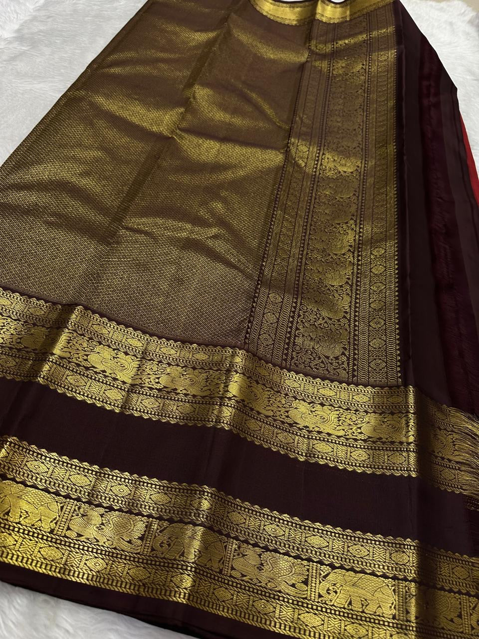 Emerald Teal Kanjipuram Rettapet saree folded view showing border and pallu