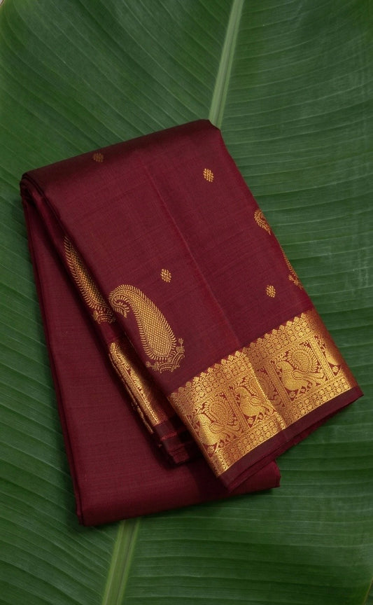 Kanchipuram silk saree in espresso brown with antique gold border Maanga Butta weave folded view