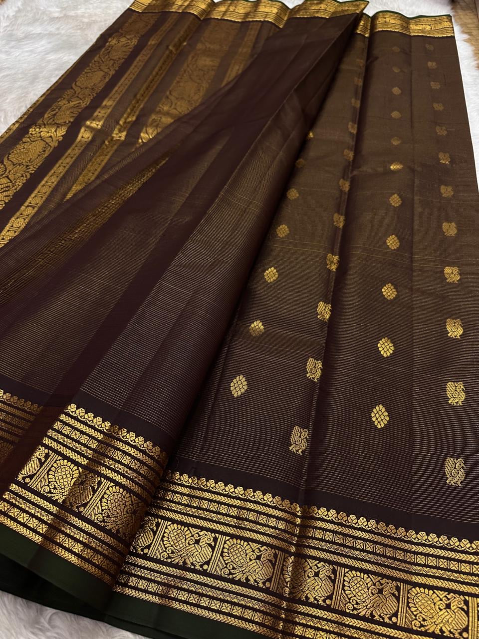 Deep espresso brown lightweight pure silk Kanchipuram saree with antique gold zari buttas
