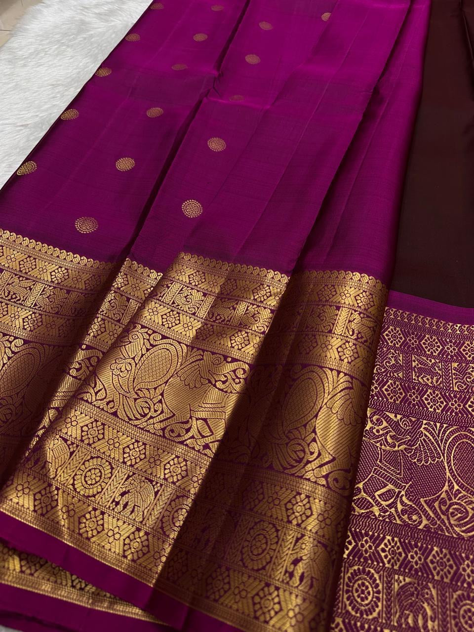 Traditional Kanchipuram saree in rich espresso brown with heritage Yazhi temple motif weaving