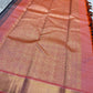 Partially draped purple black pure Kanchipuram silk saree highlighting contrast between body and heavy zari-work borders.