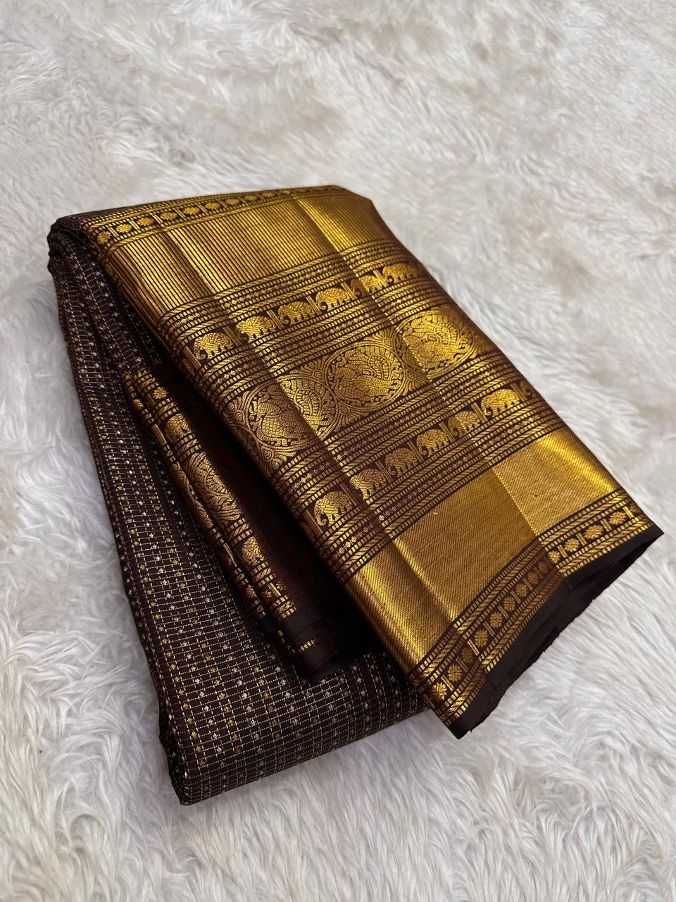 Authentic Kancheepuram silk saree with antique bronze body and temple bronze-inspired Yaanai zari craftsmanship
