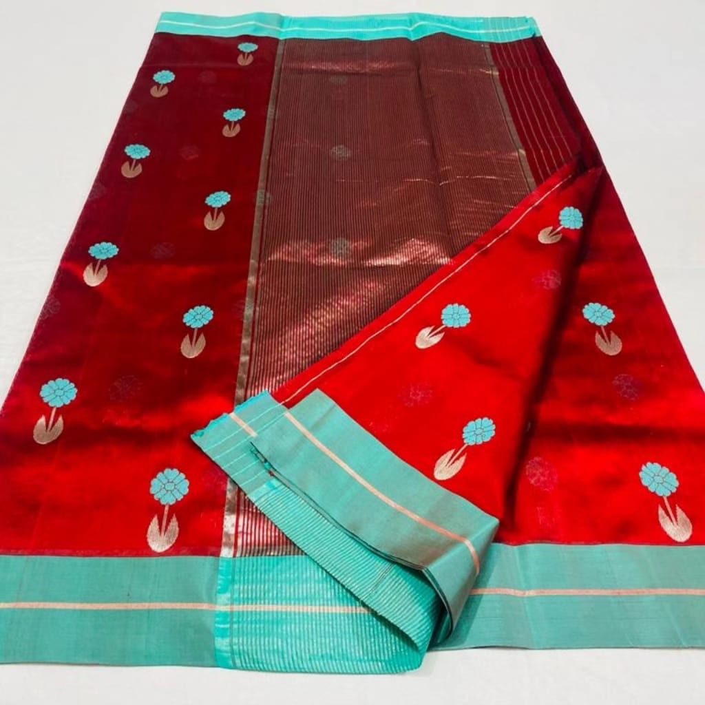 Folded Vermilion Red Chanderi saree showing the Aqua Blue floral buttas and contrast border