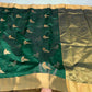 Emerald green pure silk Chanderi saree with traditional zari border displayed in elegant full drape styling