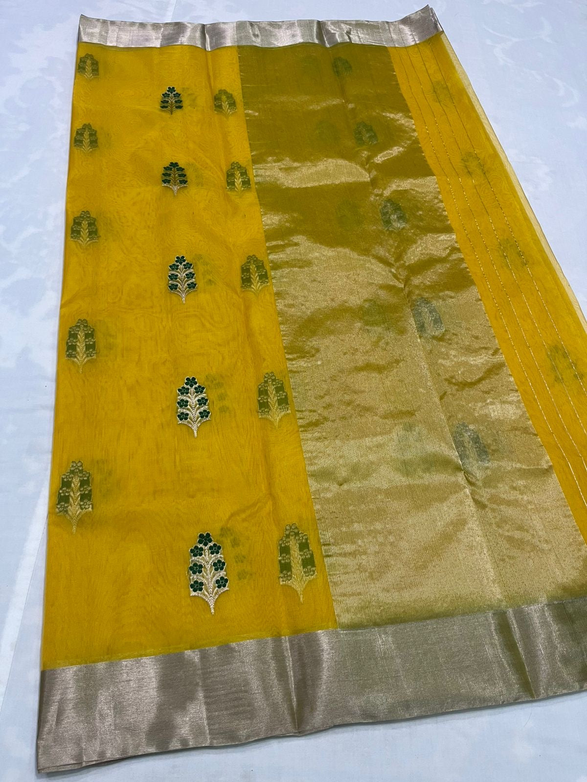Handwoven pure silk Chanderi saree in turmeric yellow with traditional motifs